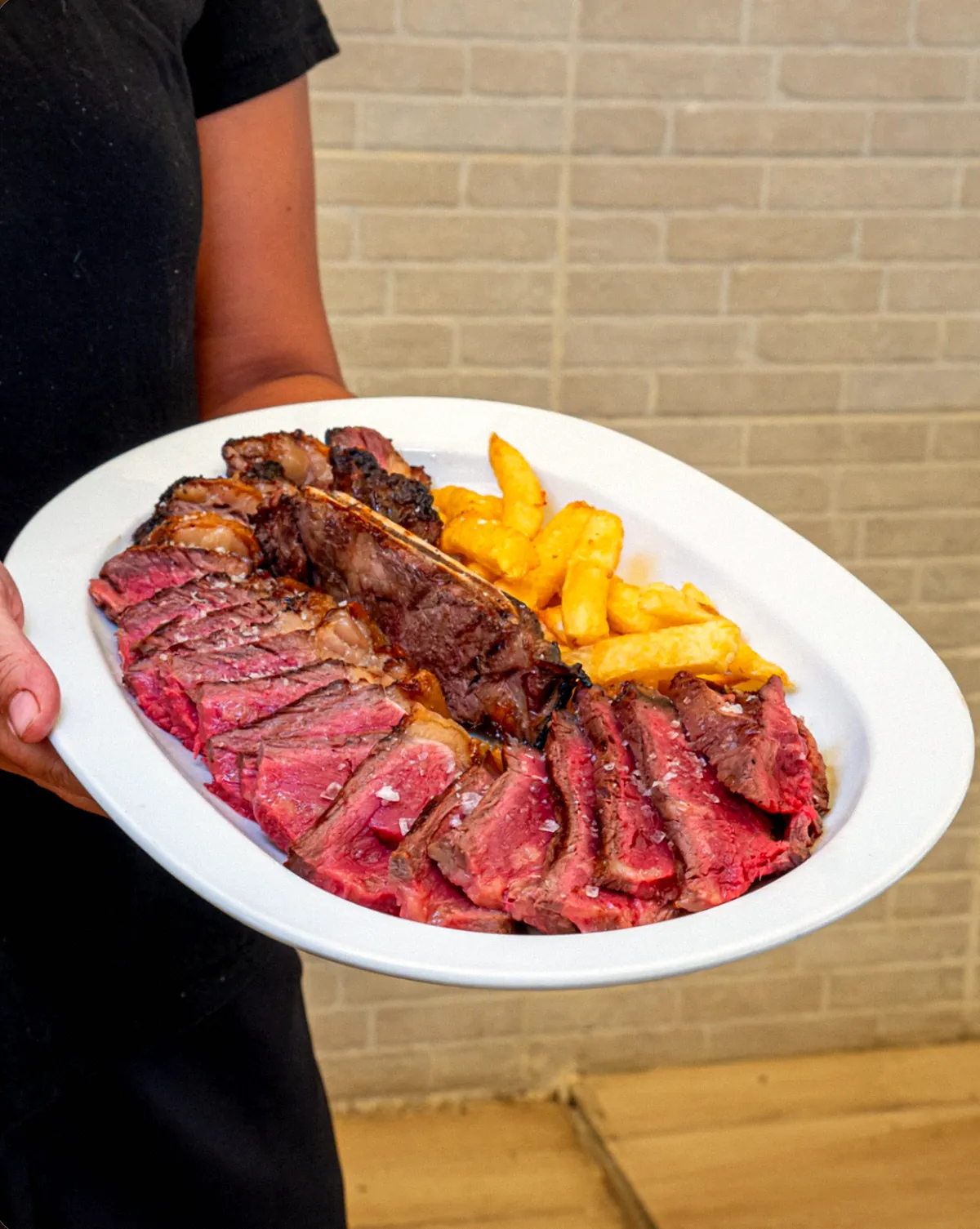 Chuletón de vaca frisona con patatas